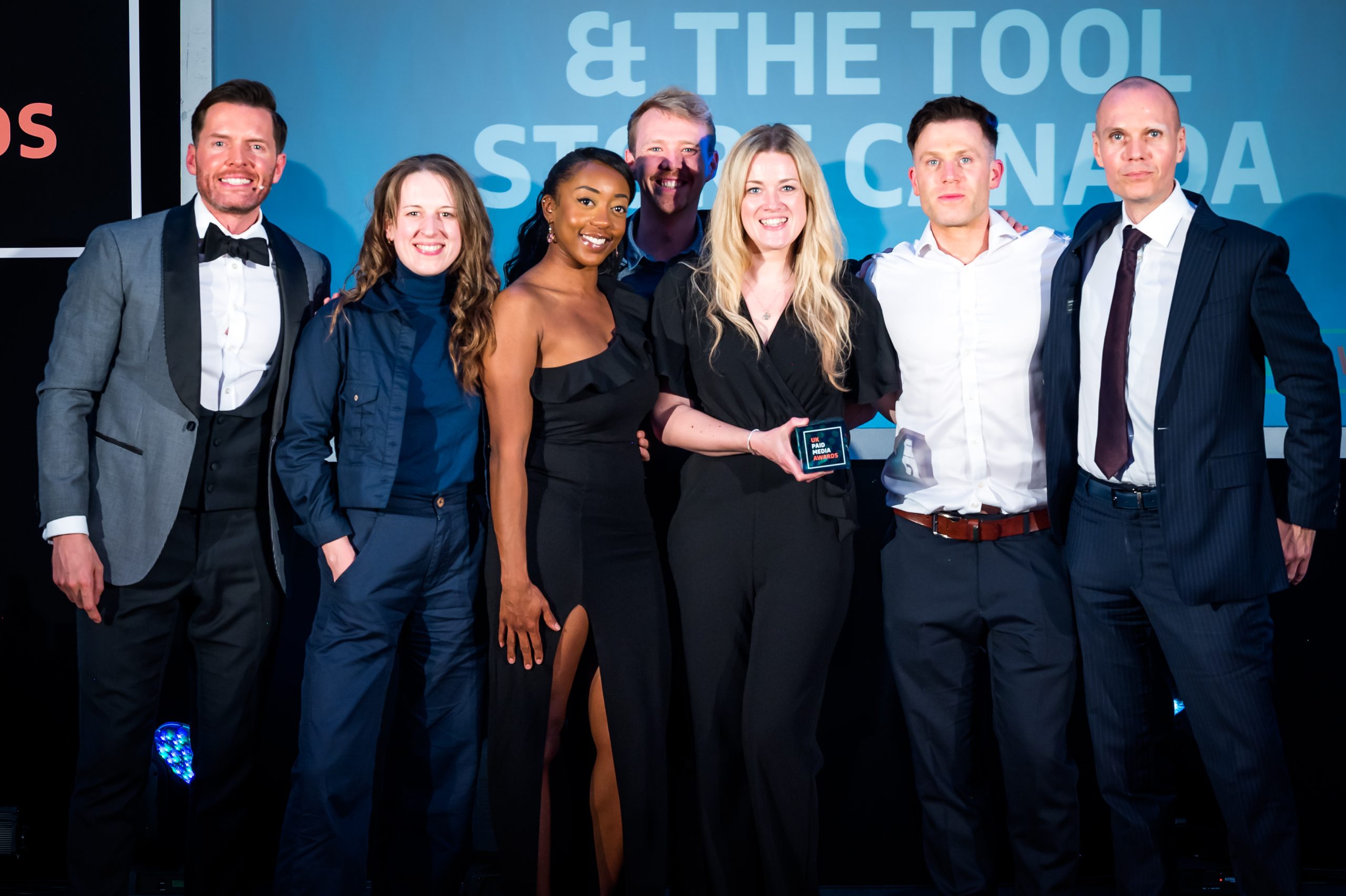 Exposure Ninja team on stage at an awards